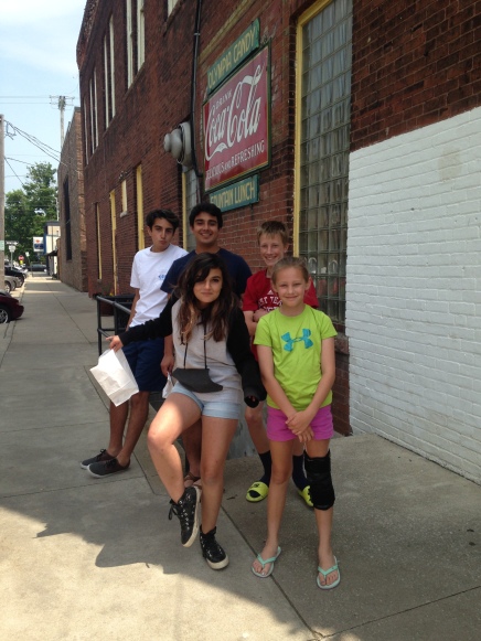 Cousins enjoying hand-made chocolates and old-fashioned phosphate sodas at the Olympia Bakery in Goshen, Indiana